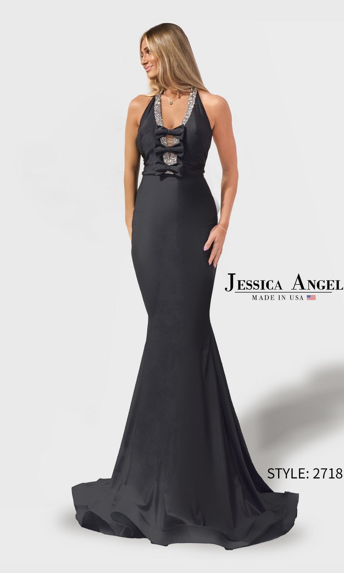 Woman in a black, floor-length mermaid prom dress with a deep V-neck and embellished neckline and waist. Text: Long Prom Dress: Jessica Angel 2718.